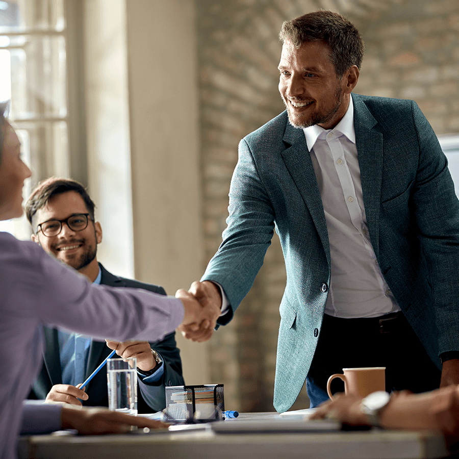 business-coworkers-shaking-hands-during-meeting-office-focus-is-businessman